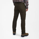 Rear view of Northward Trousers in green, showcasing comfort and practical features for outdoor activities.